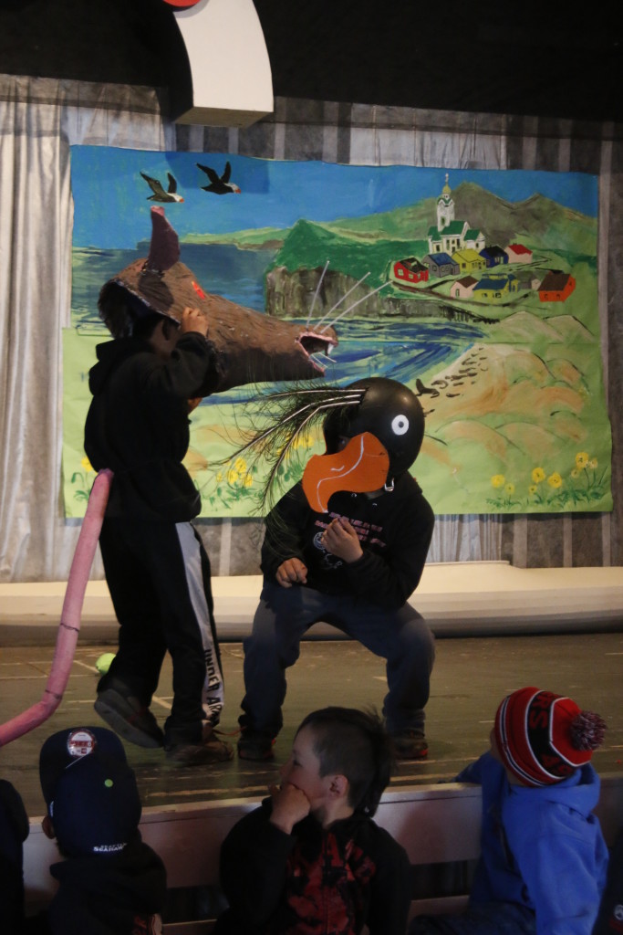 Students present a play about invasive species using masks they’ve created. Photo: Ram Papish.